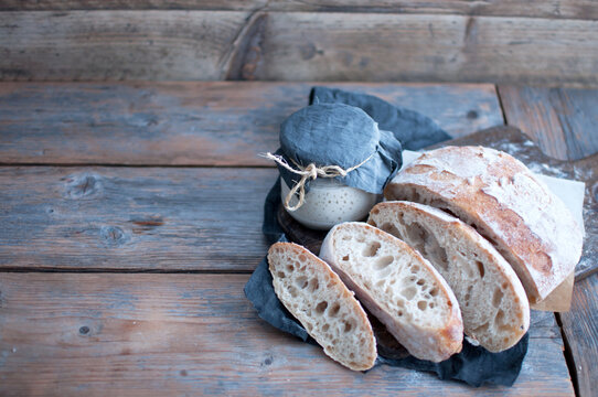 Sourdough bread and starter jar