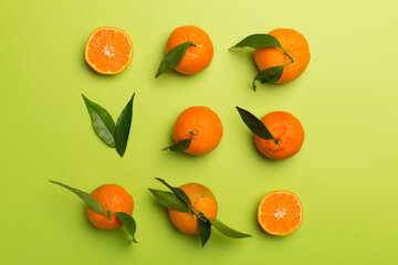 Flat lay with fresh mandarines on color background