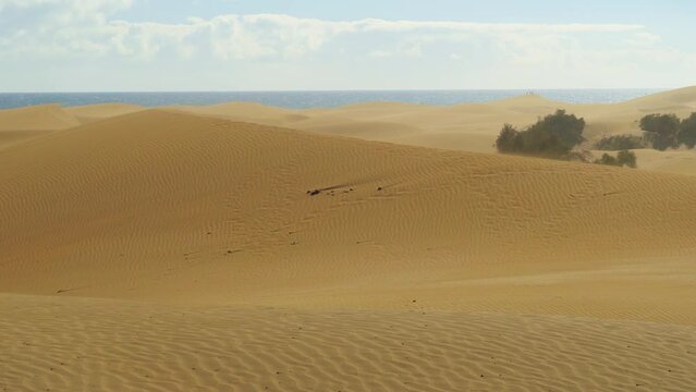 Wind blowing sand on dunes of Maspalomas, Gran Canaria, Spain