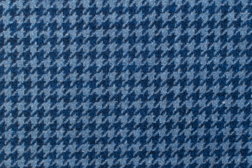 Classic tweed, Wool Background Texture. Coat close-up. Expensive men's suit fabric. Glenurquhart check is made of woolen fabric with a woven twill design of small and large checks. Houndstooth seamles