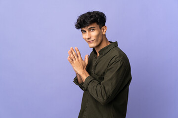Young Argentinian man isolated on background scheming something