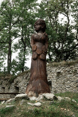 Wooden statue of Berticka girl, wife of Vitek at Vitkuv castle, Sumava mountains, Czech republic