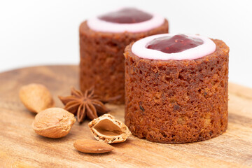 Runeberg Cakes (Runebergin Torttu) - traditional Finnish homemade pastry on a wood board, close-up. Runeberg day.