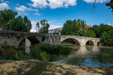 Fototapeta na wymiar ashlar stone medieval bridge in Palencia, Spain