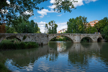 Fototapeta na wymiar ashlar stone medieval bridge in Palencia, Spain