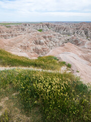 Pinnacles Overlook in Badland national park during summer. From grassland to valley. Badland landscape South Dakota.