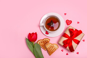 Valentine's Day breakfast in bed. Gift, tea Belgian waffles flower, , hearts on pink background. Valentines day concept.