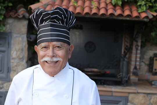 Senior chef wearing traditional uniform