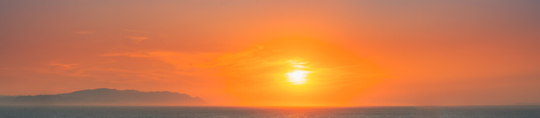 Fototapeta na wymiar Aegean Sea. Evening Sun Sunshine Above Sea. Natural Sunset Sky Warm Colors. Panorama, Panoramic View Seascape. Aegean Sea. Evening Sun Sunshine Above Sea. Natural Sunset Sky Warm Colors. Panorama