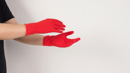 Two Hands wear red latex gloves on white background.Body part.
