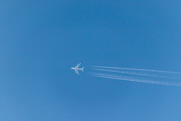 Vapor tails behind a plane