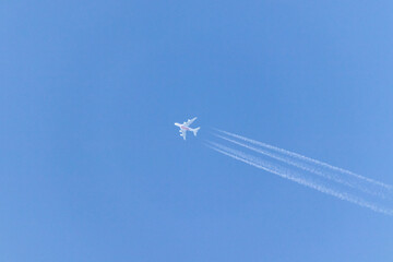 Vapor tails behind a plane