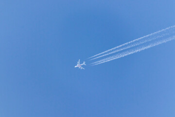 Vapor tails behind a plane