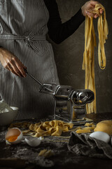 home made pasta machine with woman tagliatelli