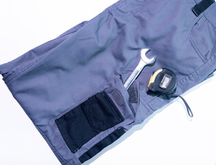 Tools in a work pants pocket.