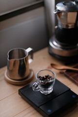 Preparing fresh coffee beans in moka pot on stove .