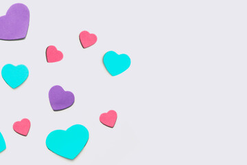 Valentine's Day background. Isolated multi-colored hearts on a white background.