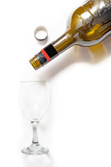 Champagne bottle and glass isolated on white. Top view, copy space