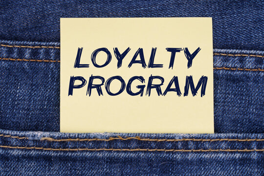 There is a paper sticking out of a jeans pocket with the inscription - Loyalty Program