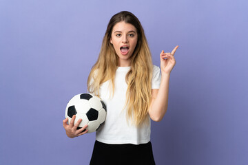 Young blonde football player woman isolated on purple background intending to realizes the solution while lifting a finger up