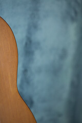 Selective focus. Classical music. Closeup image of an acoustic guitar. Music background. Detail
