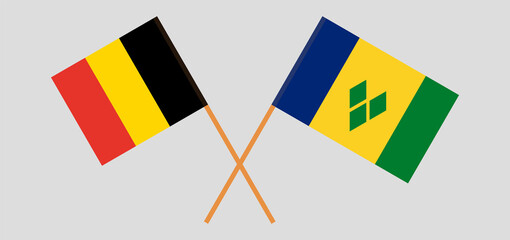 Crossed flags of Belgium and Saint Vincent and the Grenadines. Official colors. Correct proportion