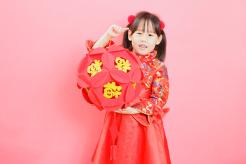 Chinese girl with traditional dressing up and holding a 