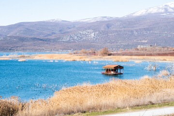 View of Vegoritida lake in Pella Greece on a sunny day in the background the mount Voras with a bit of snow 
