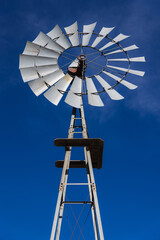 Windmill in front of a blue sky