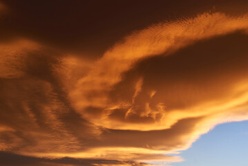 Fototapeta na wymiar Sky light after sunset. orange background, clouds