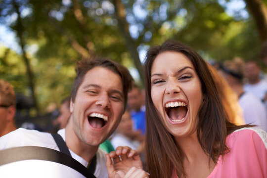 Skanderborg. Two friends screaming at the camera, having fun.