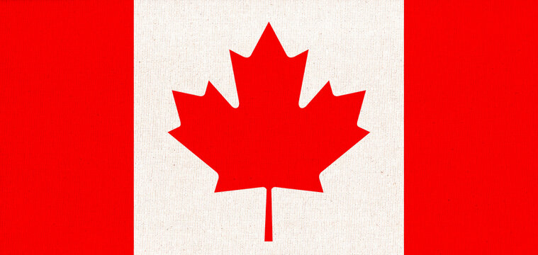 Flag of Canada. Canadian flag on fabric surface with red maple leaf on white