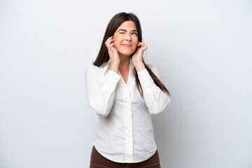 Fototapeta premium Young Brazilian woman isolated on white background frustrated and covering ears