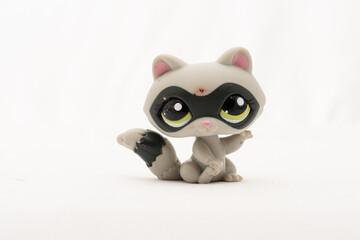 Small plastic racoon toy figure.