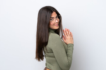 Young Brazilian woman isolated on white background scheming something