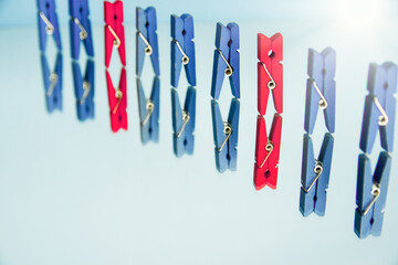 colorful wooden clothespin - abstract vision of man and woman. standing out from the crowd,...