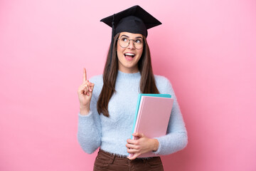 Young student Brazilian woman wearing graduated hat isolated on pink background thinking an idea...