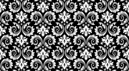 Wallpaper in the style of Baroque. Seamless vector background. White and black floral ornament. Graphic pattern for fabric, wallpaper, packaging. Ornate Damask flower ornament