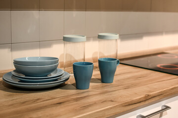 A set of blue kitchen utensils. New tableware for sale in a supermarket