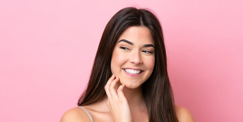 Young Brazilian woman isolated on pink background . Portrait