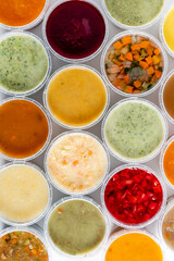 Top view of bowl with different soups