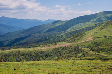 Fototapeta na wymiar Panoramic views of the beautiful landscape in the Carpathian mountains. Tourism or Freedom concept. Wild nature, summer landscape. Discover the beauty of earth.