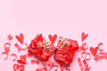 Gifts for Valentine's Day and serpentine on pink background