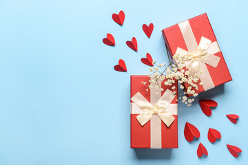 Gifts for Valentine's Day and hearts on blue background