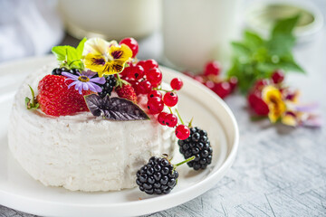 fresh ricotta with berries and flowers