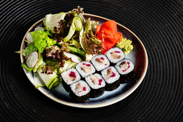 sushi on the black plate