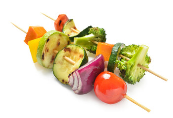 Skewers with vegetables on white background