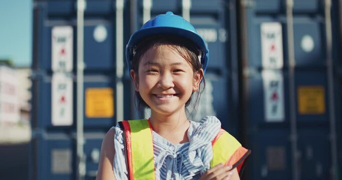 Portrait of a little girl in with safety helmet engineer concept