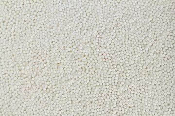 raw organic sabudana or sago pearll as food or health related concept background