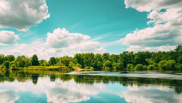 Pan Panorama Calm Hyperlapse Summer Cloudy Sky Above Summer River Landscape Lake. Time lapse. 4K Timelapse. Sky Clouds Reflections In Water.